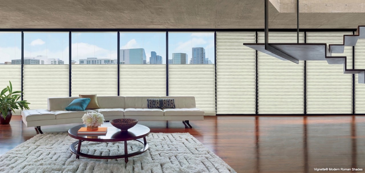 A living room with a textured rug.